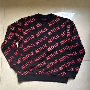 Netflix Black and Red Crewneck Sweater with Bold Pattern